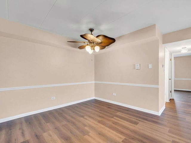 unfurnished room with wood-type flooring and ceiling fan