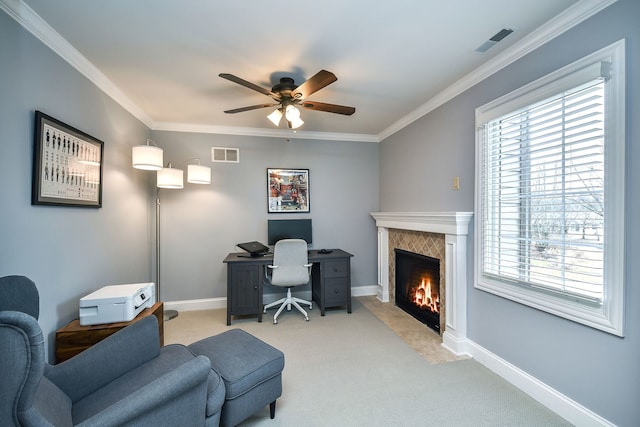 carpeted office featuring ornamental molding, plenty of natural light, and visible vents