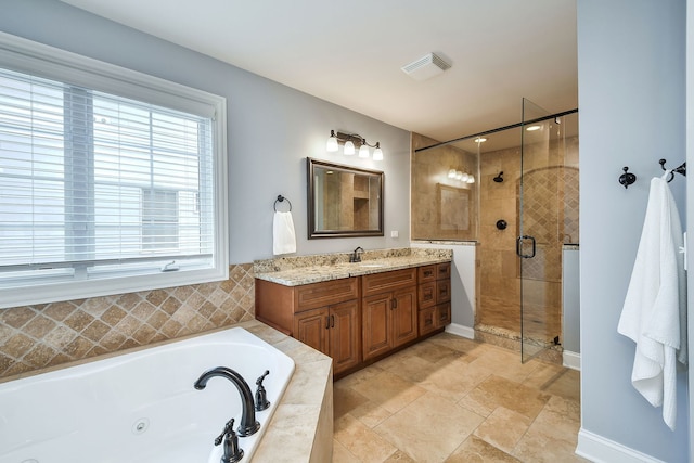 bathroom with vanity, visible vents, baseboards, a whirlpool tub, and a stall shower