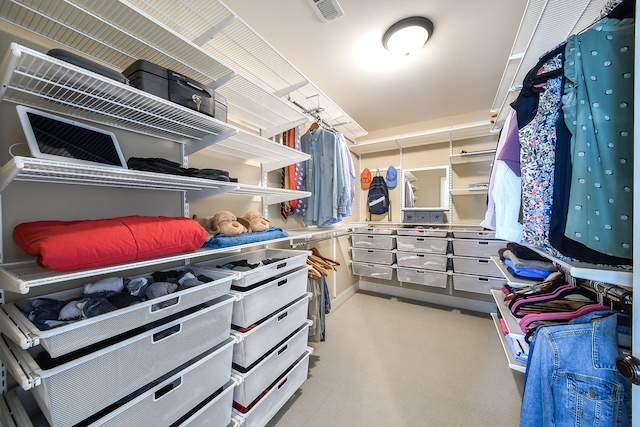 spacious closet with visible vents and carpet flooring