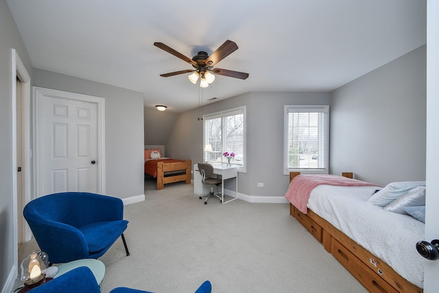 bedroom with a ceiling fan, carpet flooring, and baseboards