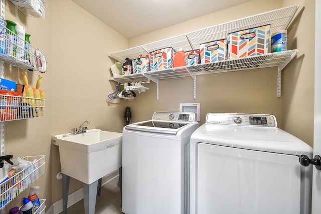 clothes washing area with laundry area and washing machine and dryer