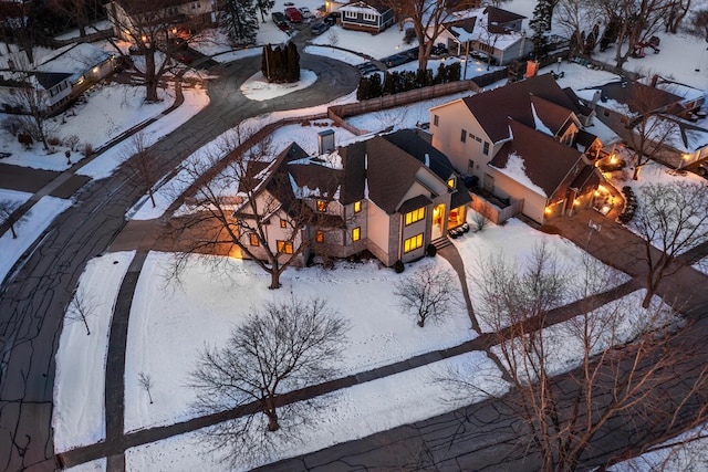 snowy aerial view featuring a residential view