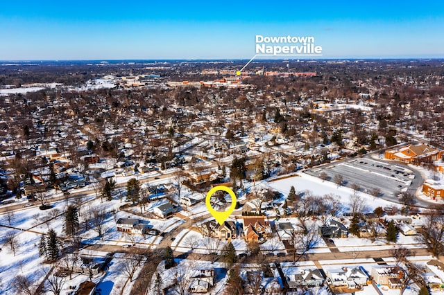 snowy aerial view with a residential view