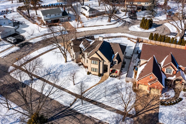 snowy aerial view featuring a residential view