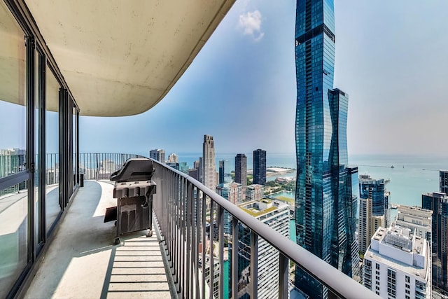 balcony featuring a water view