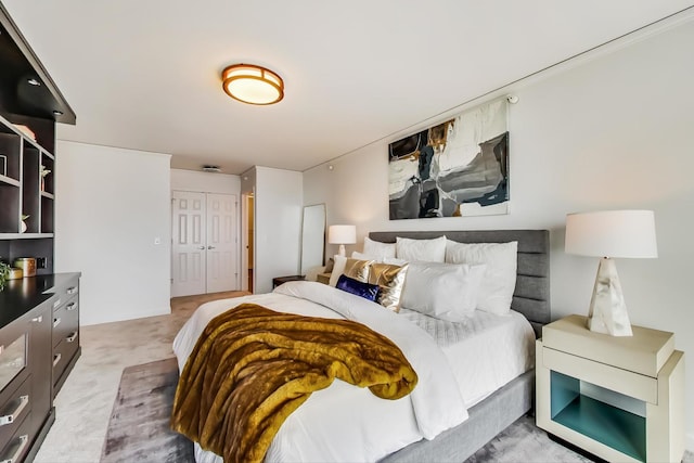 carpeted bedroom with a closet