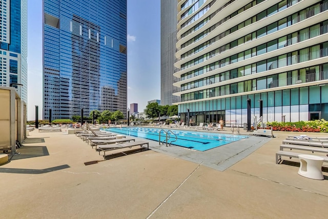 view of swimming pool with a patio