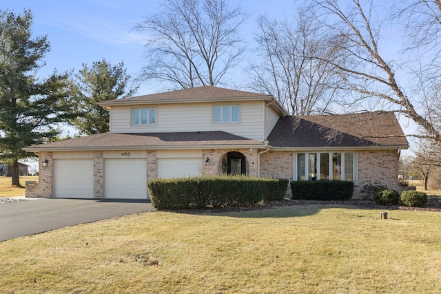 front facade with a garage and a front yard