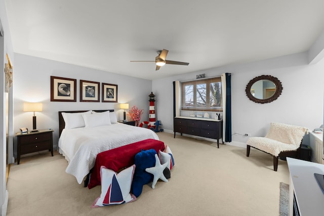 bedroom featuring light carpet and ceiling fan