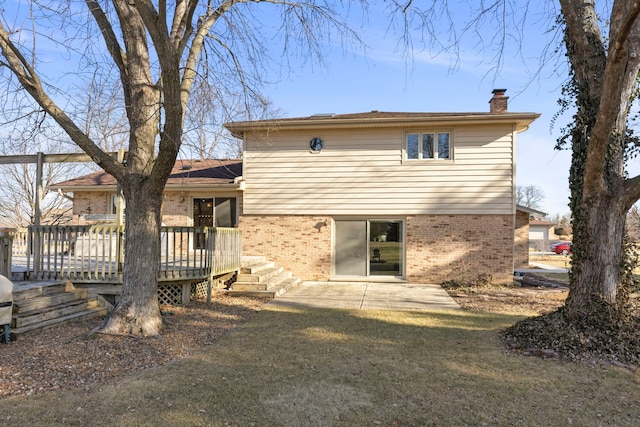 rear view of property with a patio area, a deck, and a lawn