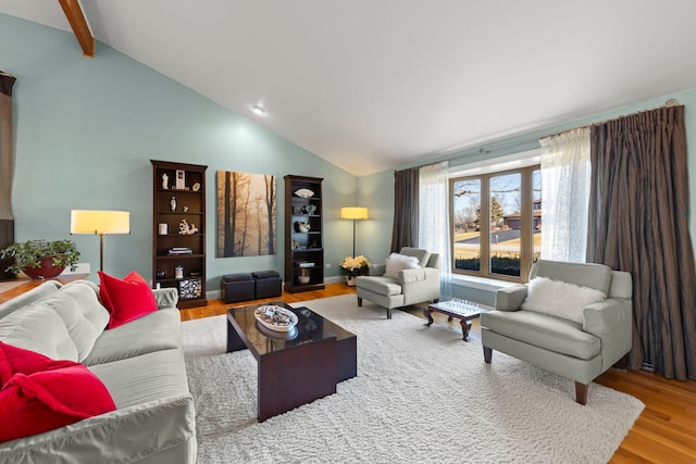 living room featuring hardwood / wood-style flooring and high vaulted ceiling