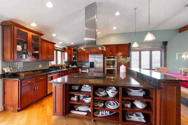 kitchen featuring dark stone countertops, hanging light fixtures, stainless steel appliances, a center island, and island exhaust hood