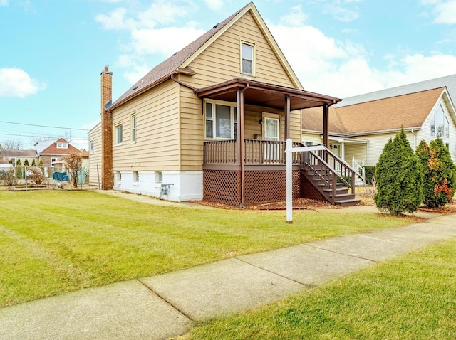 view of front of property featuring covered porch and a front yard