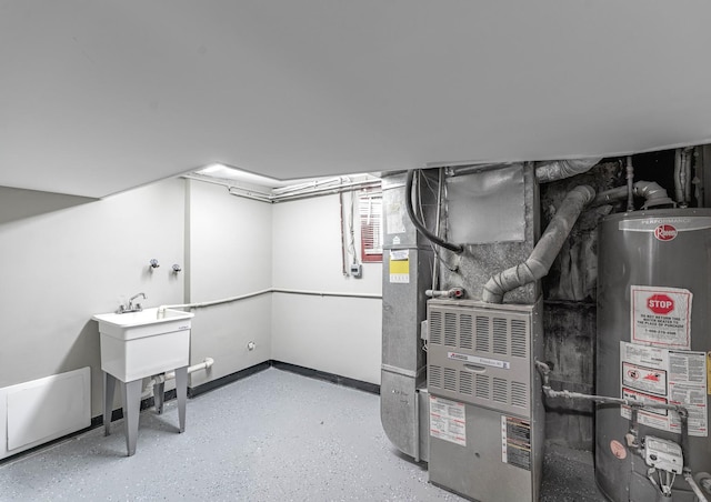 utility room with heating unit and gas water heater