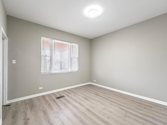 unfurnished room featuring light hardwood / wood-style flooring