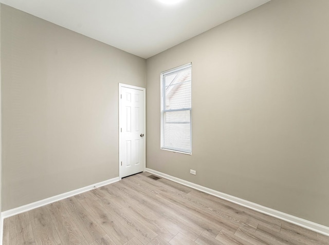 unfurnished room with light hardwood / wood-style floors