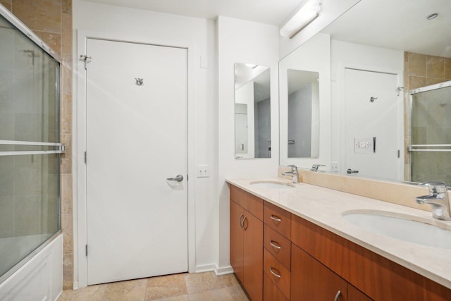 bathroom with vanity and enclosed tub / shower combo