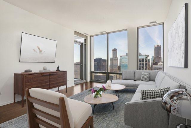 living room featuring hardwood / wood-style flooring and floor to ceiling windows