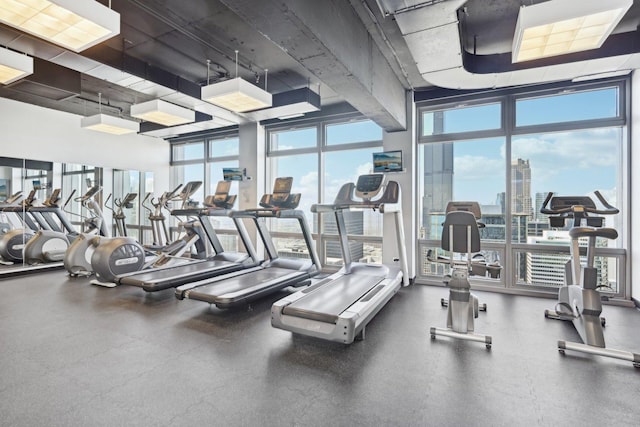 workout area featuring floor to ceiling windows