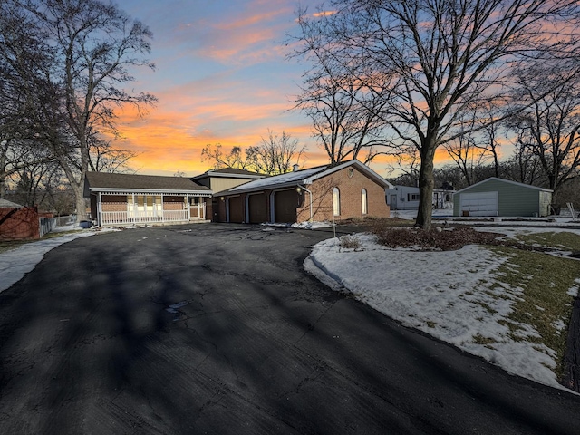 single story home with a porch