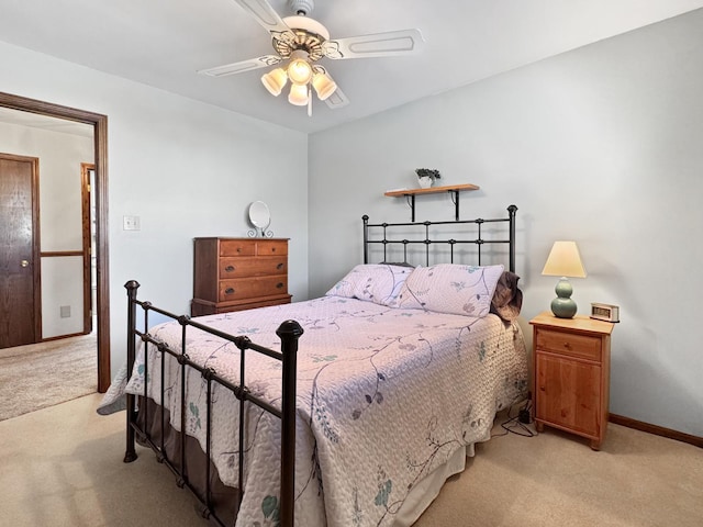 bedroom with light colored carpet and ceiling fan