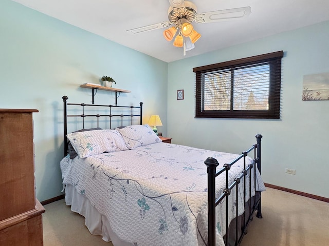 bedroom with light carpet and ceiling fan