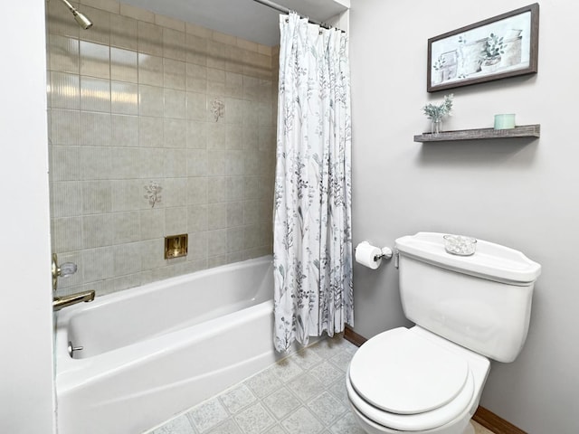 bathroom featuring shower / bathtub combination with curtain and toilet