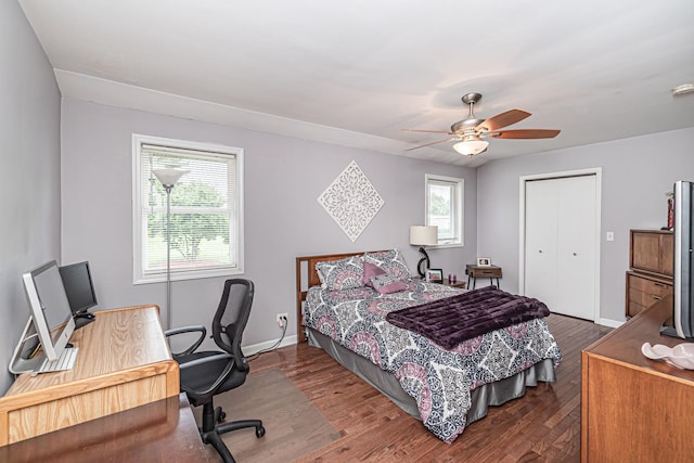 bedroom with baseboards, a closet, ceiling fan, and wood finished floors