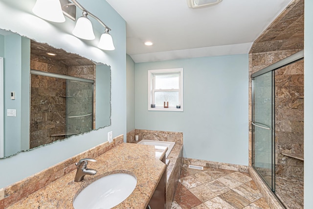 full bathroom with a stall shower, a bathing tub, baseboards, and recessed lighting