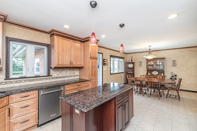 kitchen with light tile patterned floors, tasteful backsplash, decorative light fixtures, and dishwasher