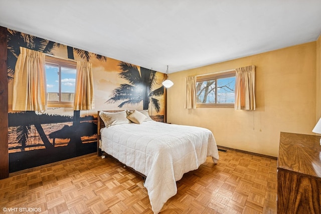 bedroom with multiple windows and visible vents