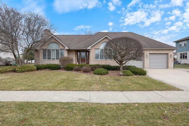 ranch-style house with a garage and a front lawn