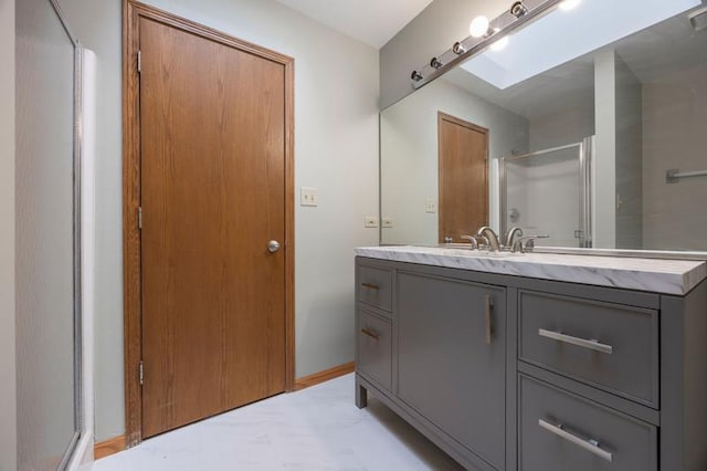 bathroom featuring vanity and an enclosed shower