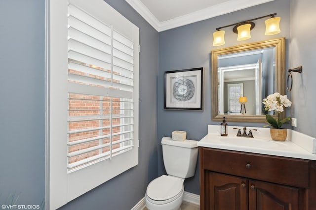 bathroom with crown molding, vanity, and toilet