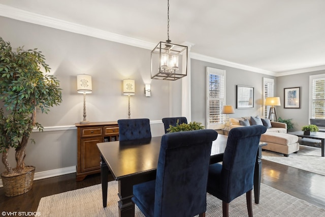 dining area featuring crown molding and dark hardwood / wood-style flooring