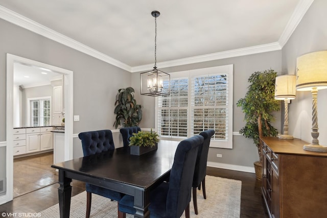 dining space with crown molding, a notable chandelier, and dark hardwood / wood-style flooring