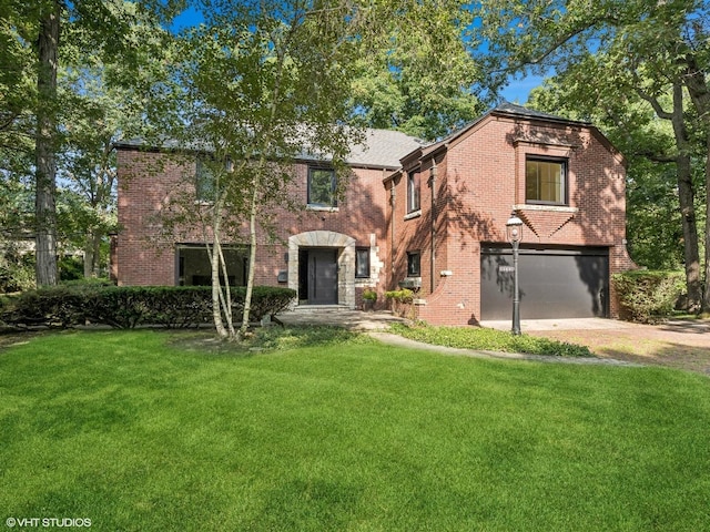 view of front of house with a garage and a front lawn