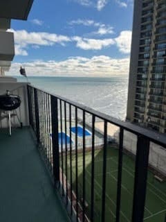 balcony featuring a water view