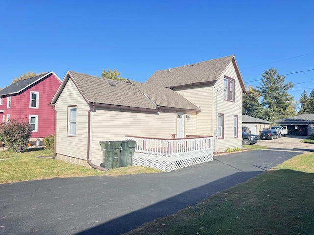 view of side of home featuring a yard