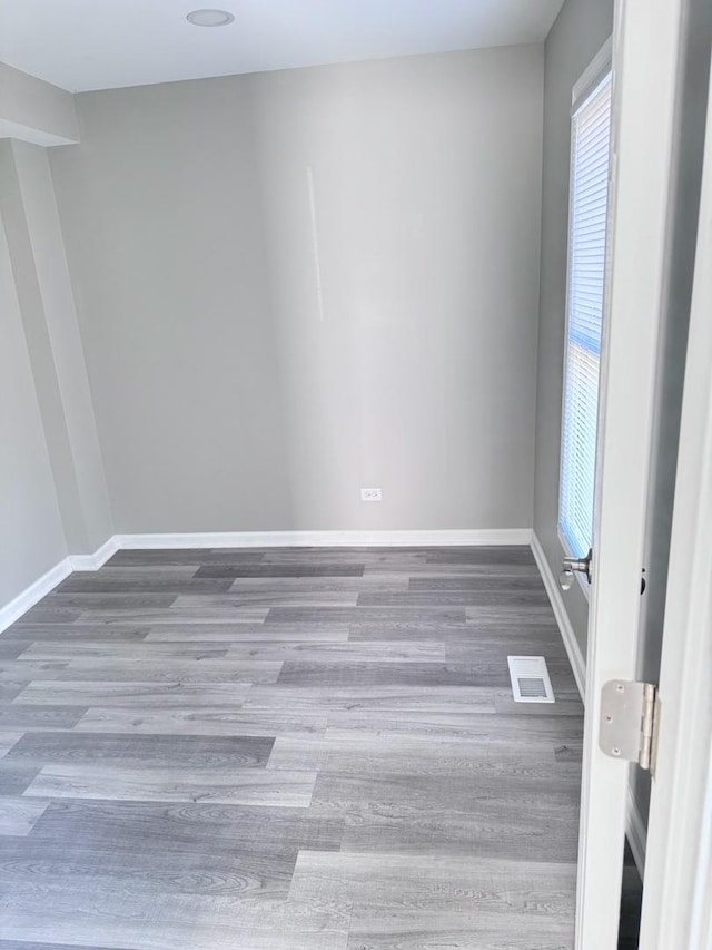 unfurnished room featuring wood-type flooring