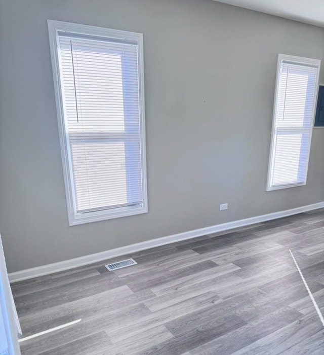 unfurnished room featuring light hardwood / wood-style flooring