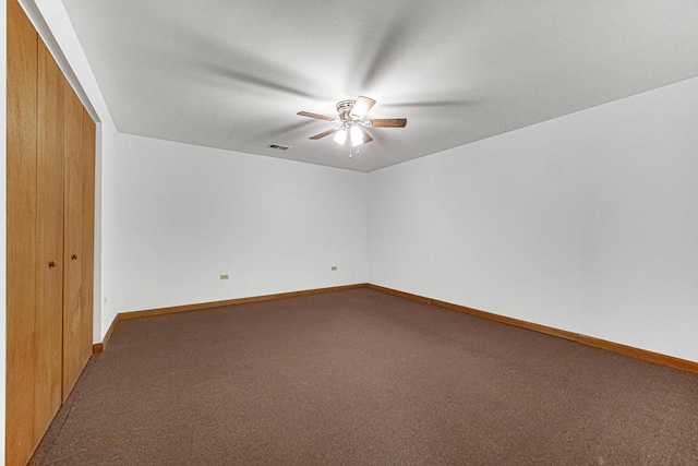 spare room with carpet flooring and ceiling fan