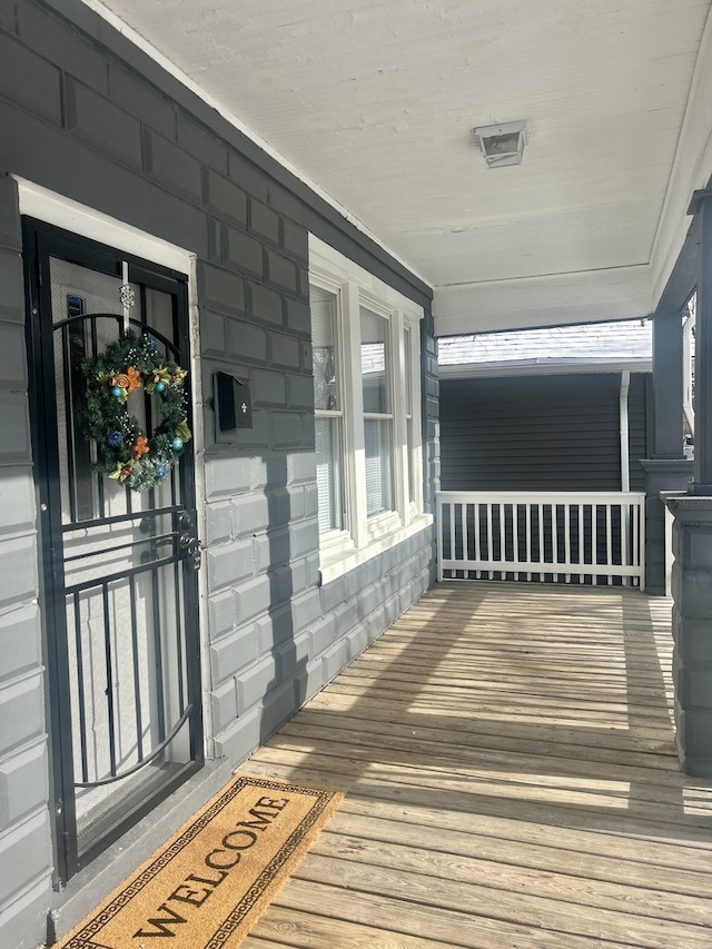 wooden deck featuring covered porch