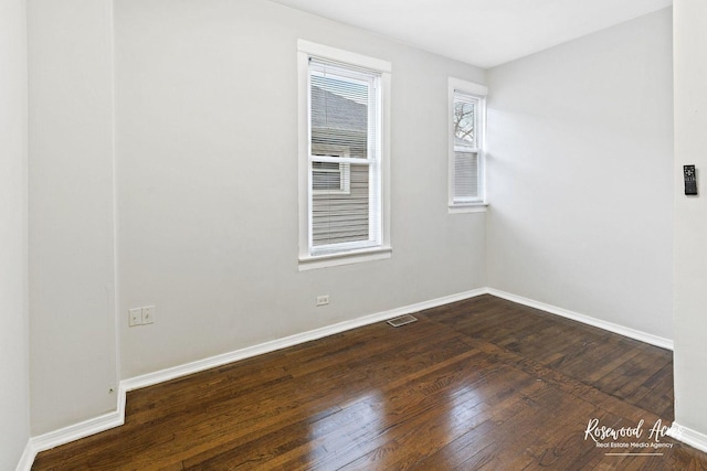 empty room featuring dark hardwood / wood-style floors