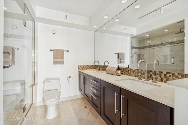 10 E Ontario St Unit 4308, Chicago, IL 60611 - full bathroom featuring toilet, double vanity, a shower stall, baseboards, and recessed lighting