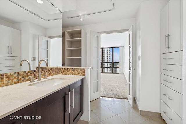 10 E Ontario St Unit 4308, Chicago, IL 60611 - bathroom with tasteful backsplash, vanity, and tile patterned flooring