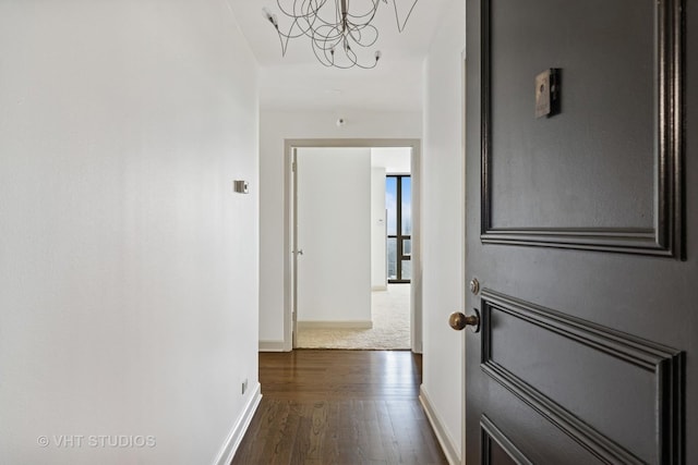 10 E Ontario St Unit 4308, Chicago, IL 60611 - hall featuring dark wood-type flooring, baseboards, and a chandelier