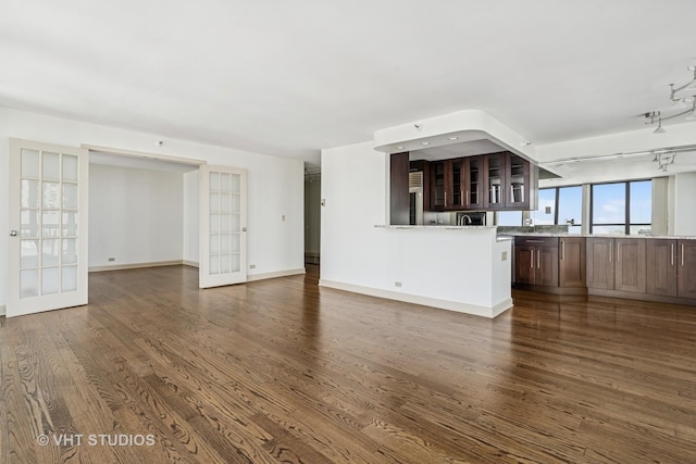 10 E Ontario St Unit 4308, Chicago, IL 60611 - unfurnished living room with dark wood finished floors, french doors, and baseboards