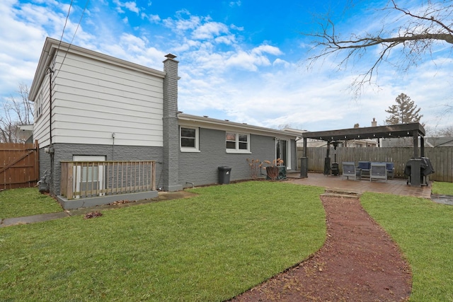 rear view of house featuring a pergola, a lawn, and a patio area